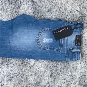 Light blue wash skinny jeans (torn style)